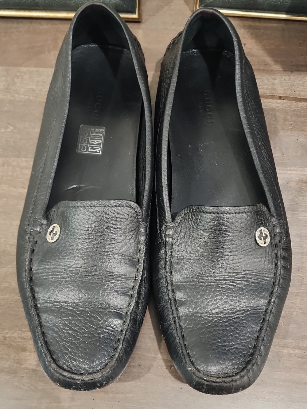 Authentic Gucci Black Pebbled Leather Slip-On Loafers with Silver Logo Studs